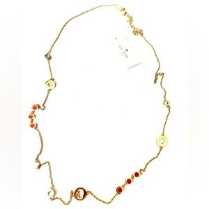 Kate Spade Gold Necklace with Supprs Coral Accents spot the spade